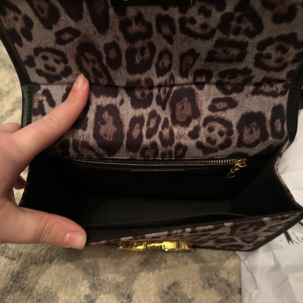 Leopard and black shoulder/crossbody bag with gold hardware. Brand new!